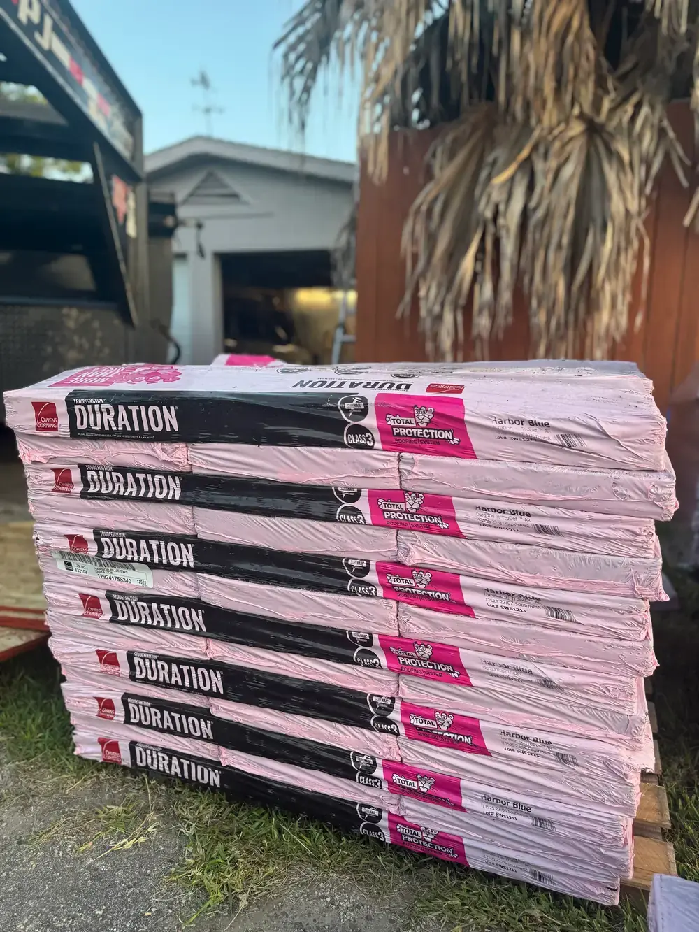 Owens Corning Duration shingle bundles staged for a job