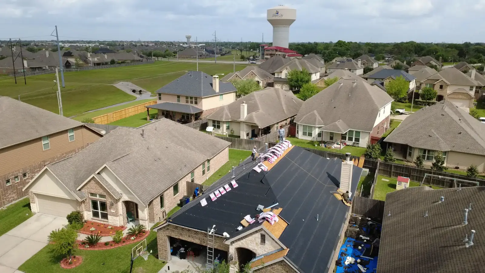 Aerial view of a completed Shultz roof over a Houston neighborhood
